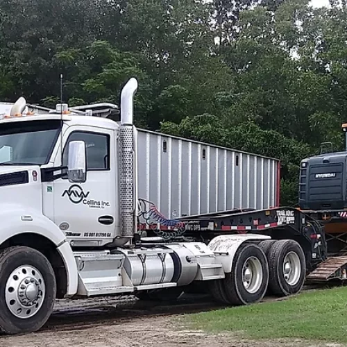 Dozer loaded onto MW Collins semi truck
